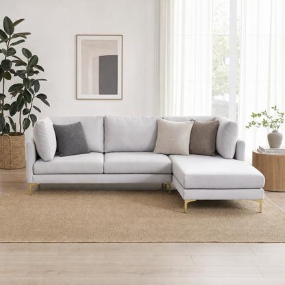 Glitz - L shape sectional sofa in light silver-grey fabric, front view in a modern living room